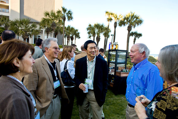 (L to R) White and Dean David Wu catch up with Bill Kuhl '66 and wife Alice.